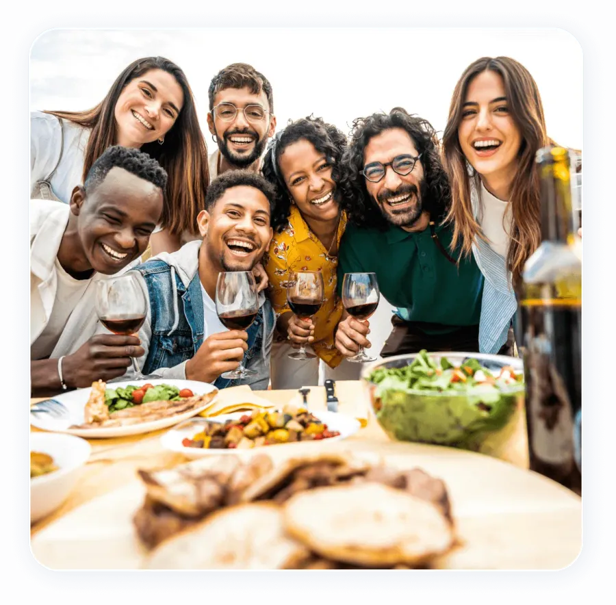 A group of young people enjoying a potluck dinner together