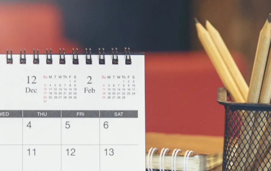 Calendar on a desk — the default theme of the Whocan Scheduling Poll
